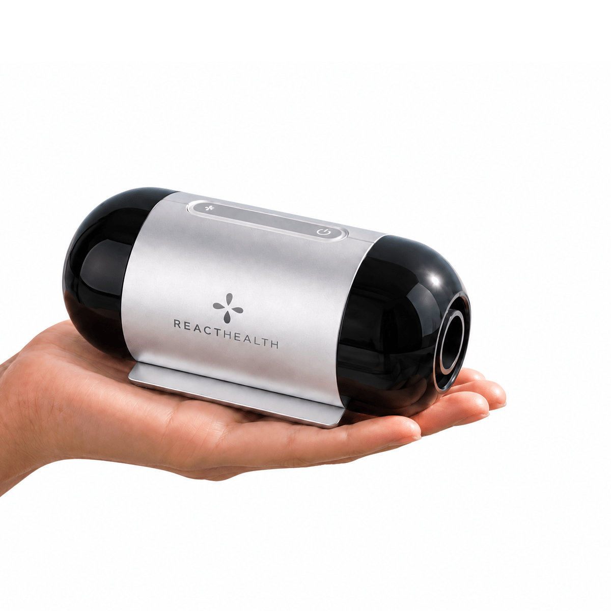 Hand holding the React Health Luna TravelPAP travel CPAP