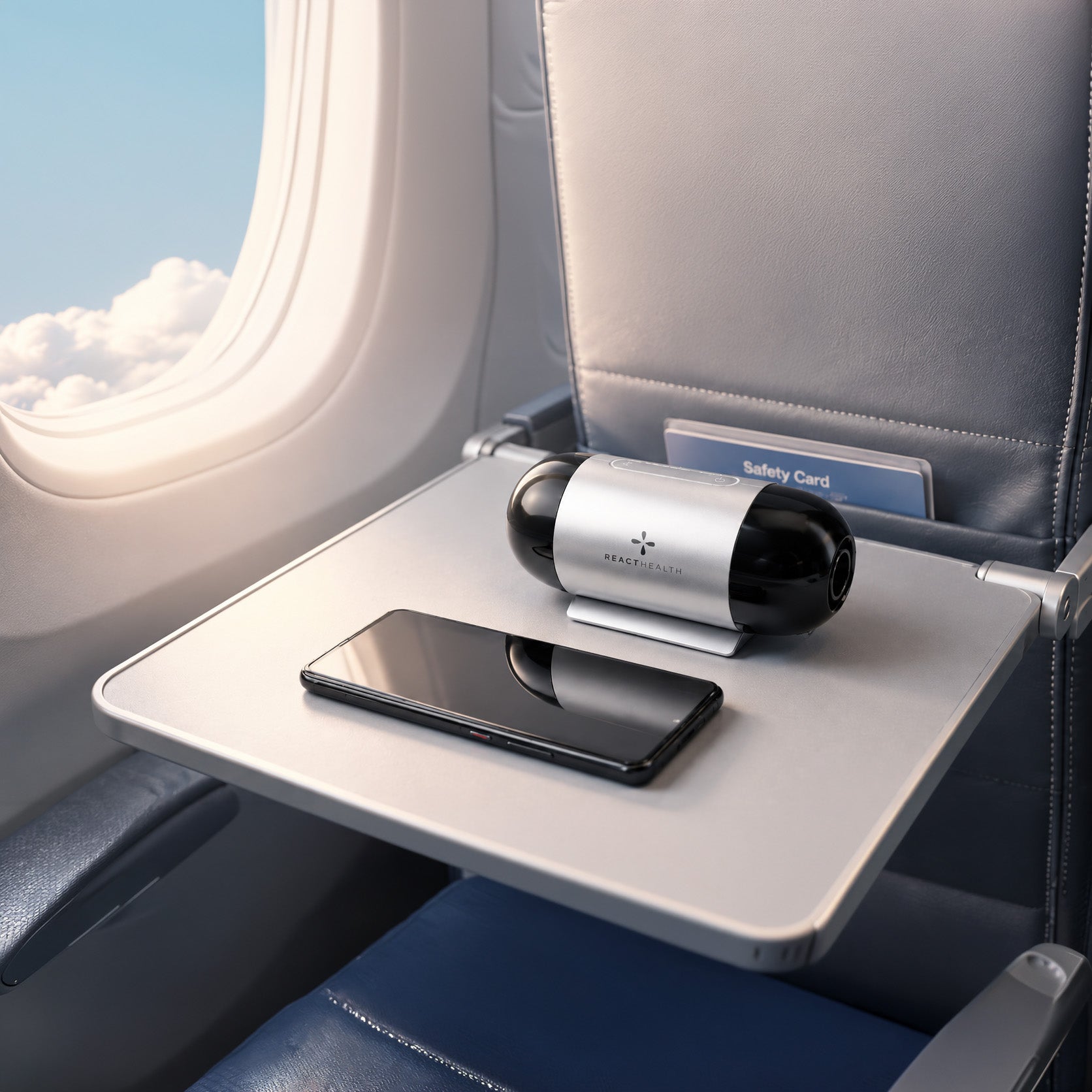 React Health Luna TravelPAP travel CPAP machine on an airplane tray table beside a phone