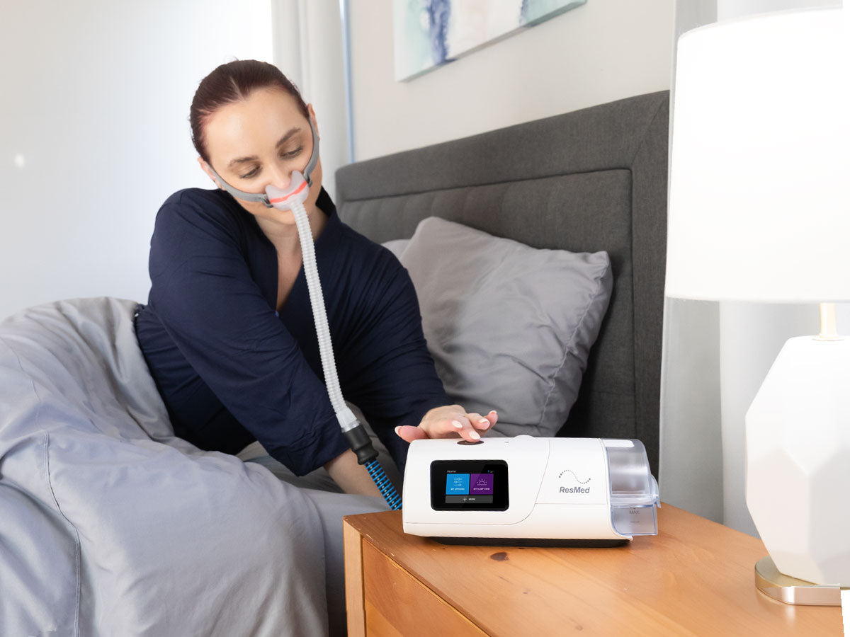 ResMed AirCurve 11 on a bedside table